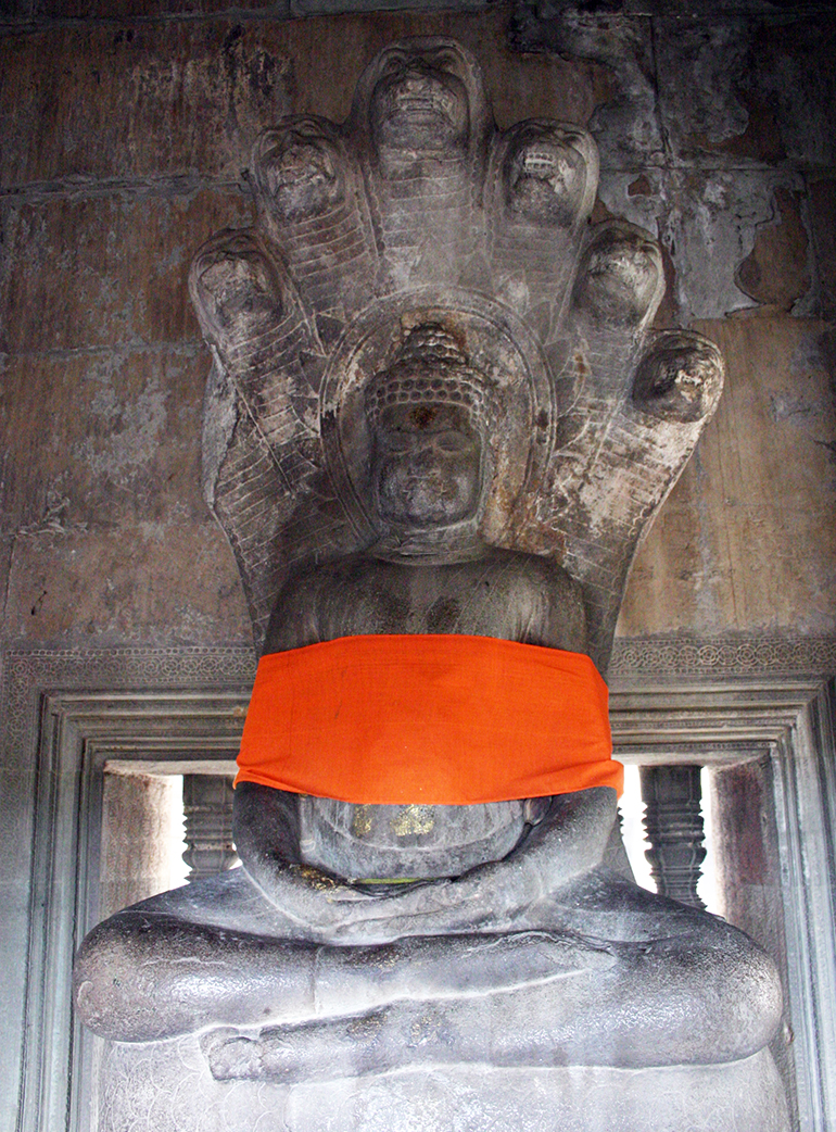 A buddha statue in Angkor Wat, Cambodia, photograph by Russ Smith